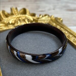 Elegant glass bracelet (or bangle) with a swirled, multi-color design